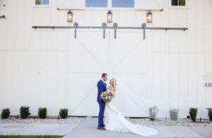 Brandon and Adiya Hauge Wedding in front of barn door
